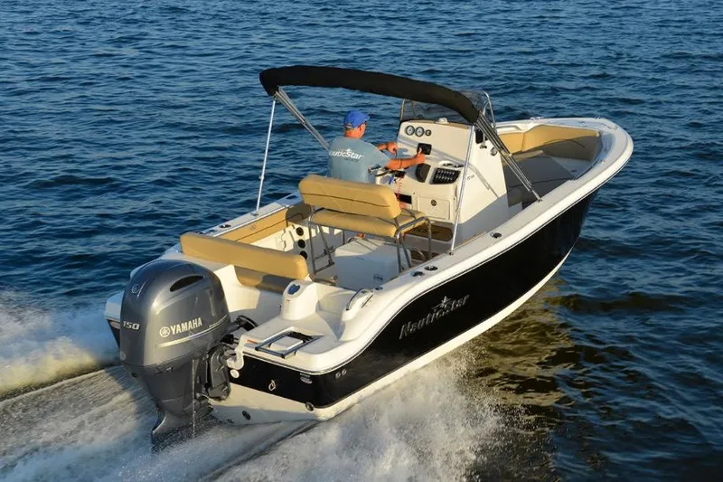 Slide: The Image of Manufacturer Provided Image: 2020 NauticStar 20 XS Offshore boat cruising on water. - 12