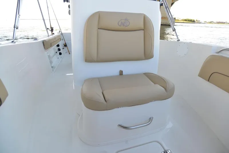 Slide: The Image of Manufacturer Provided Image: 2020 NauticStar 20 XS Offshore boat interior with tan cushioned seating. - 17