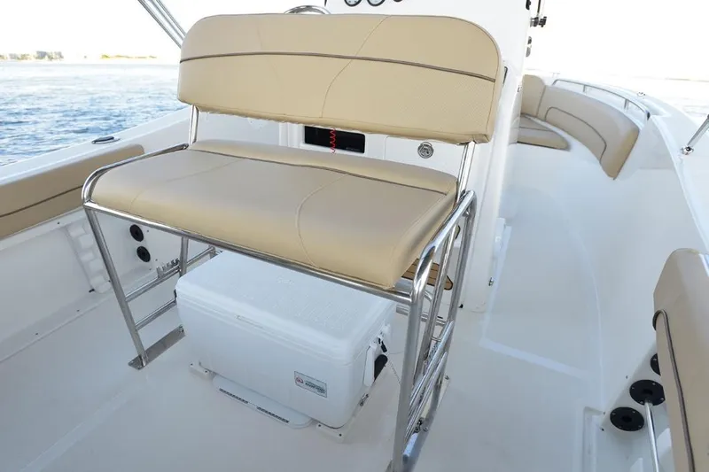 Slide: The Image of Manufacturer Provided Image: 2020 NauticStar 20 XS Offshore boat interior with seating and cooler. - 19