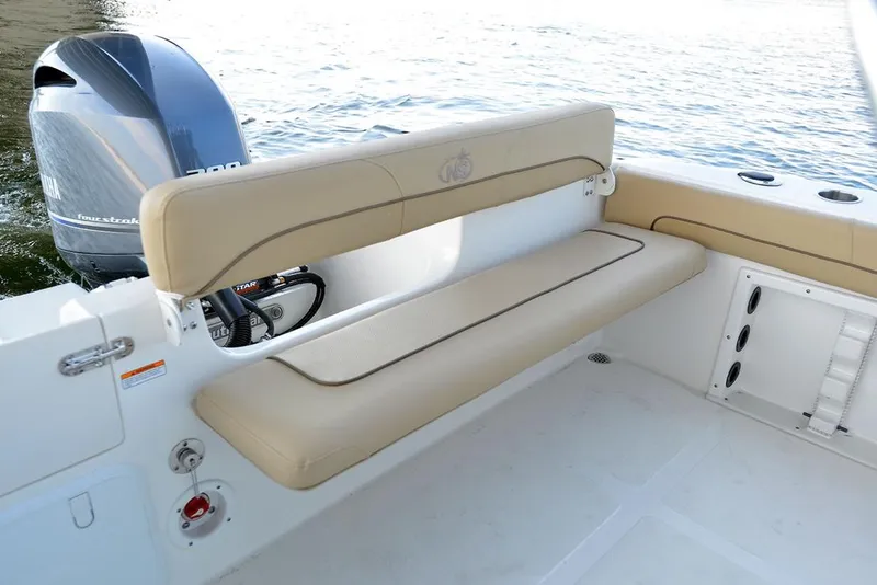 Slide: The Image of Manufacturer Provided Image: 2020 NauticStar 20 XS Offshore boat with cushioned seating and Yamaha outboard motor. - 20