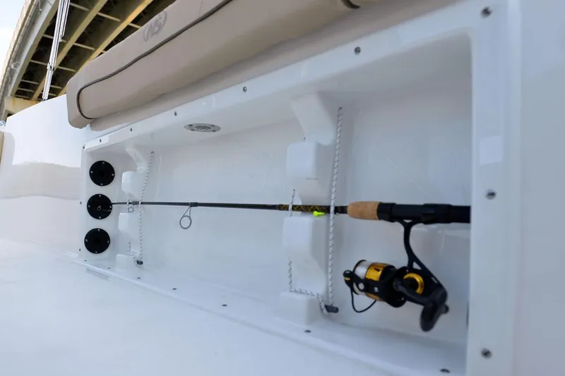 Slide: The Image of Manufacturer Provided Image: 2020 NauticStar 20 XS Offshore fishing rod storage compartment. - 21