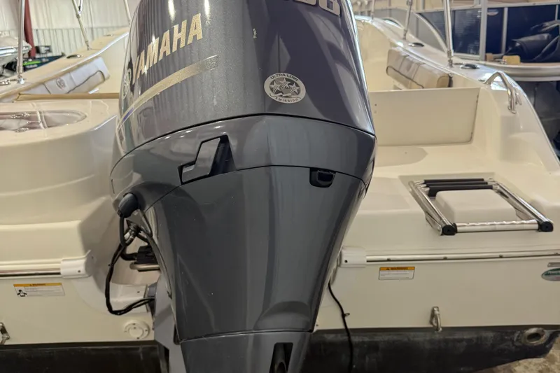 Slide: The Image of 2020 NauticStar 20 XS Offshore boat with Yamaha outboard motor in a showroom. - 6