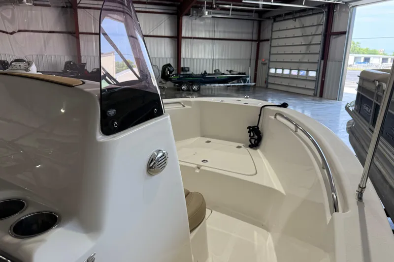 Slide: The Image of 2020 NauticStar 20 XS Offshore boat interior in a spacious garage setting. - 7