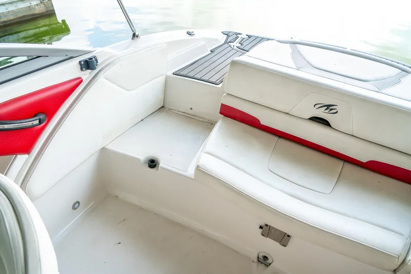 Slide: The Image of Interior of a 2013 Monterey 204FS boat with white and red seating. - 10