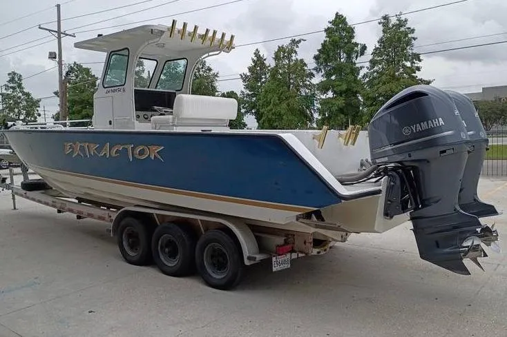 Slide: The Image of 2005 INTIMIDATOR 32 CC boat on trailer with Yamaha outboard motor. - 5