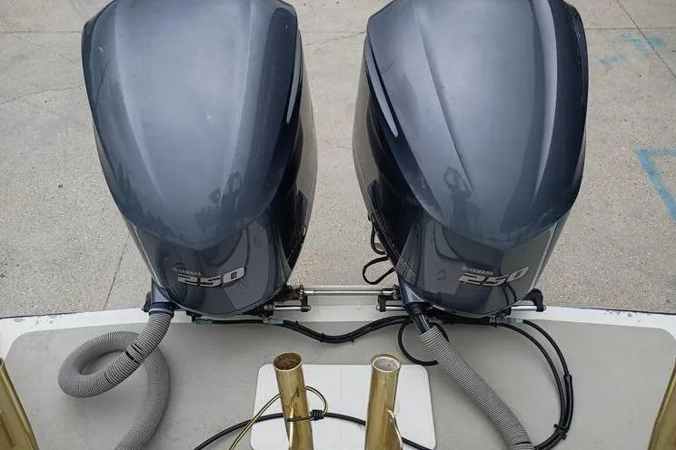 Slide: The Image of Twin Yamaha 250 outboard motors on a 2005 INTIMIDATOR 32 CC boat. - 8