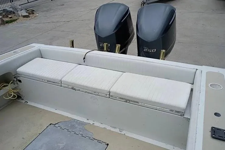 Slide: The Image of 2005 INTIMIDATOR 32 CC boat with dual 250 horsepower engines and white seating. - 9