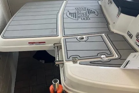 Slide: The Image of 2025 Chaparral 23 Surf boat deck with sleek design and branding. - 3