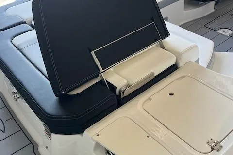 Slide: The Image of 2025 Chaparral 23 Surf boat interior seating and storage compartment. - 4