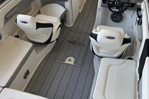 Slide: The Image of 2025 Chaparral 23 Surf boat interior with sleek seating and modern dashboard design. - 6