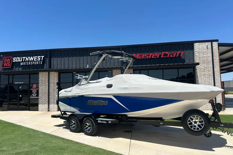 Slide: The Image of 2021 Malibu Wakesetter 21 MLX boat covered, parked at Southwest Watersports. - 20