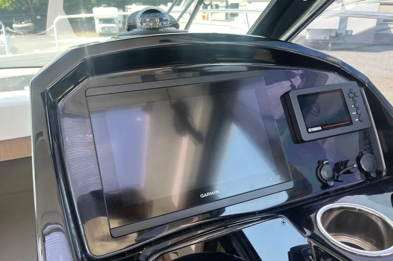Slide: The Image of Dashboard of 2020 Jeanneau NC 895 with Garmin and Yamaha displays. - 21