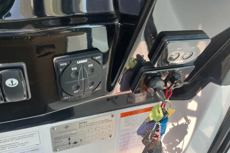 Slide: The Image of Control panel of a 2020 Jeanneau NC 895 boat with keys and switches. - 24