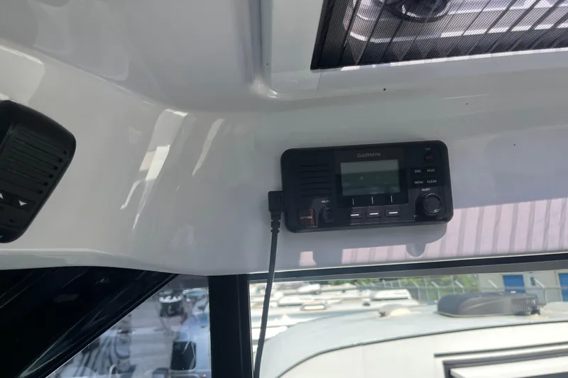 Slide: The Image of Garmin radio installed on 2020 Jeanneau NC 895 boat interior. - 26