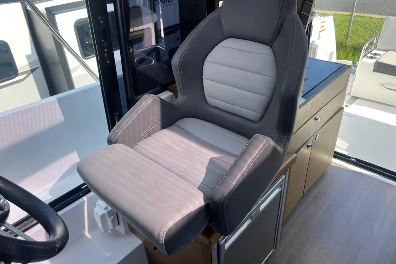 Slide: The Image of Captain's chair on 2020 Jeanneau NC 895 boat, featuring sleek design and comfortable seating. - 28