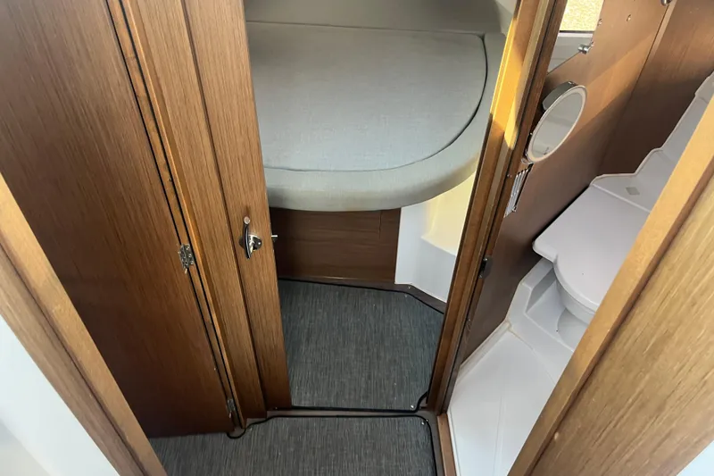Slide: The Image of 2020 Jeanneau NC 895 interior cabin with bed and compact bathroom. - 34