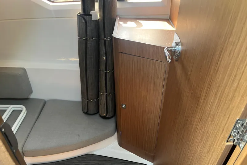 Slide: The Image of Interior of 2020 Jeanneau NC 895 boat, featuring wood cabinetry and seating area. - 41