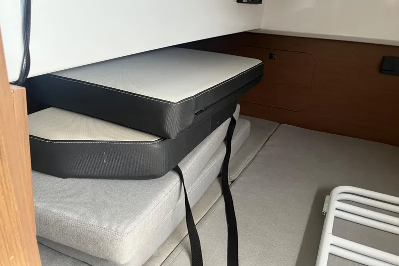 Slide: The Image of Interior cabin cushions of 2020 Jeanneau NC 895 boat, neatly stacked. - 44