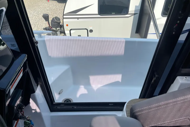 Slide: The Image of Interior view of a 2020 Jeanneau NC 895 boat, showing seating and window. - 46