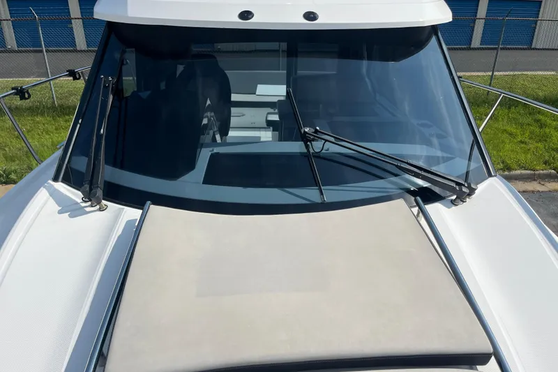 Slide: The Image of 2020 Jeanneau NC 895 boat windshield and deck view with wipers. - 49