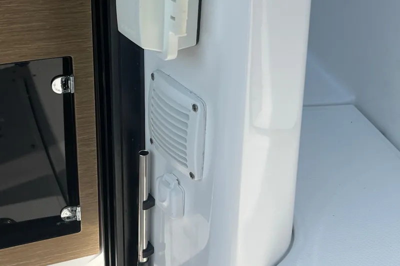 Slide: The Image of Interior detail of 2020 Jeanneau NC 895 boat, featuring a vent and handle. - 52