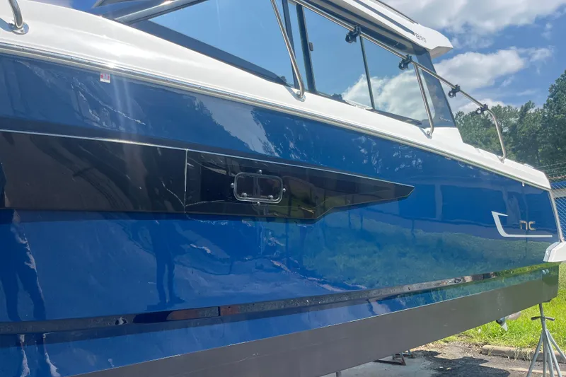 Slide: The Image of 2020 Jeanneau NC 895 boat with sleek blue exterior and modern design. - 7