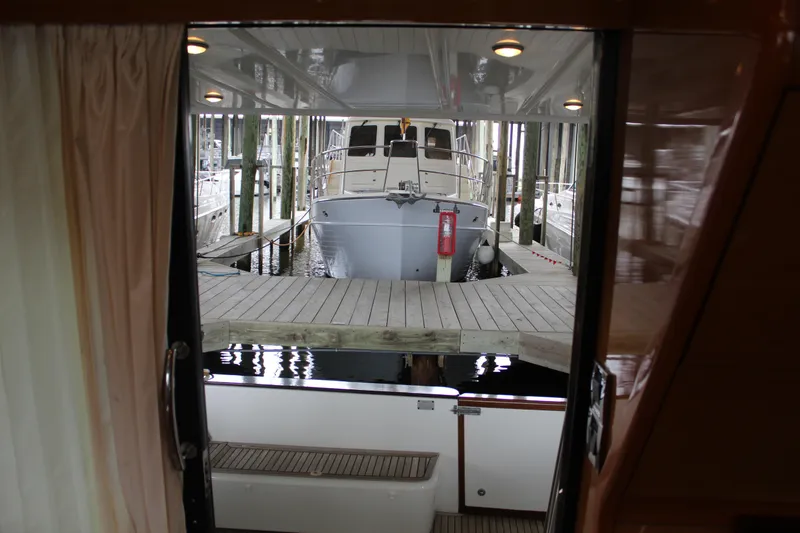 Slide: The Image of View from inside a 2005 Beneteau Antares 13.80 yacht, looking out to a docked boat. - 11