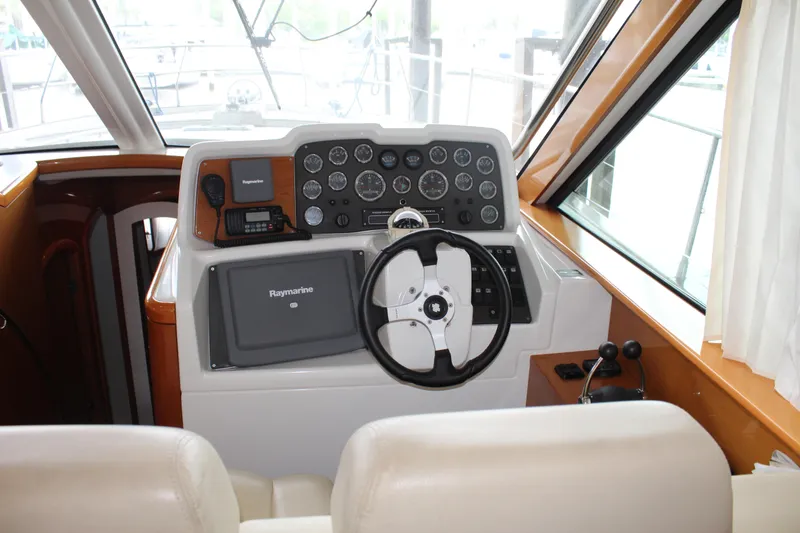 Slide: The Image of Helm station of a 2005 Beneteau Antares 13.80 with Raymarine navigation system. - 14