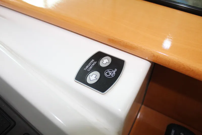 Slide: The Image of Beneteau Antares 13.80 2005 thruster control panel on wooden dashboard. - 15