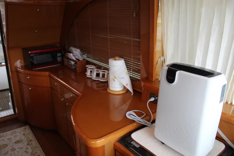 Slide: The Image of Interior of 2005 Beneteau Antares 13.80 yacht kitchen with appliances. - 16