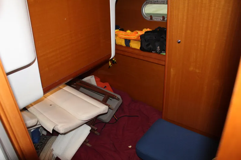 Slide: The Image of Interior cabin of a 2005 Beneteau Antares 13.80 boat with wooden furnishings. - 20