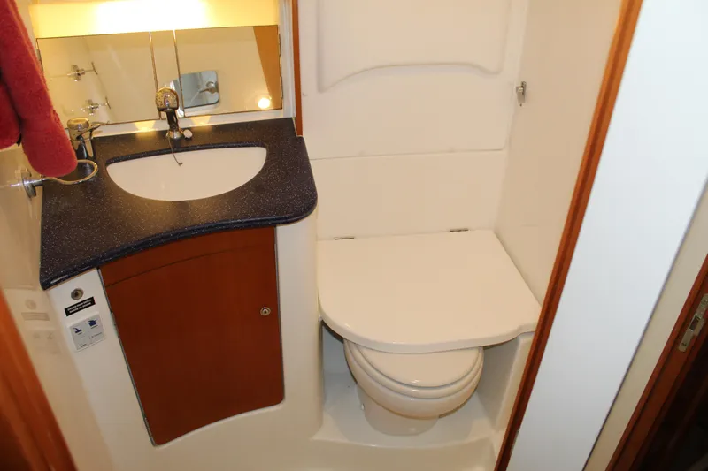 Slide: The Image of Compact bathroom in 2005 Beneteau Antares 13.80 yacht with sink and toilet. - 22