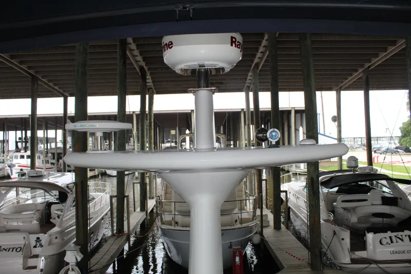 Slide: The Image of 2005 Beneteau Antares 13.80 docked in a covered marina. - 40