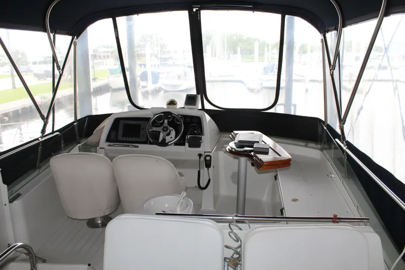 Slide: The Image of Cockpit of 2005 Beneteau Antares 13.80 with helm station and seating. - 42