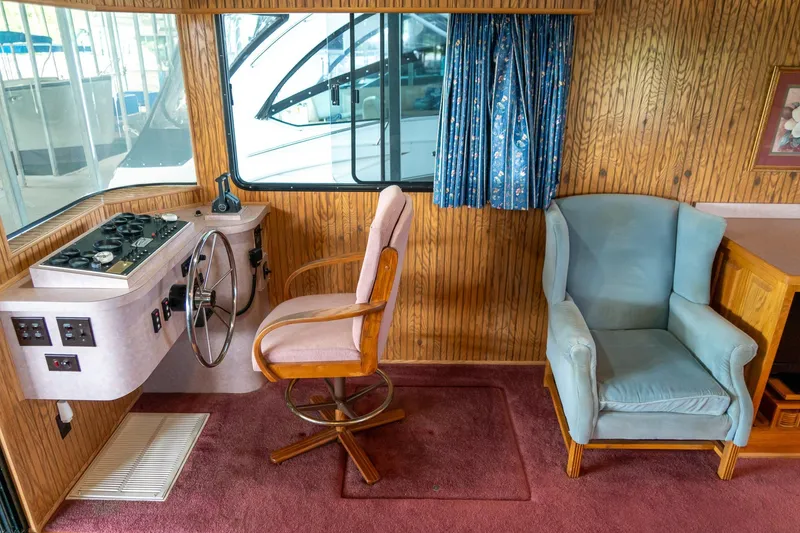 Slide: The Image of Interior of 1995 Lakeview 62 x 14 Widebody Houseboat with helm and seating area. - 15