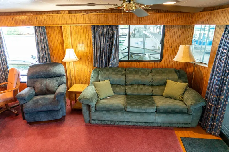 Slide: The Image of Cozy living area in 1995 Lakeview houseboat with sofa, recliner, and lamps. - 19