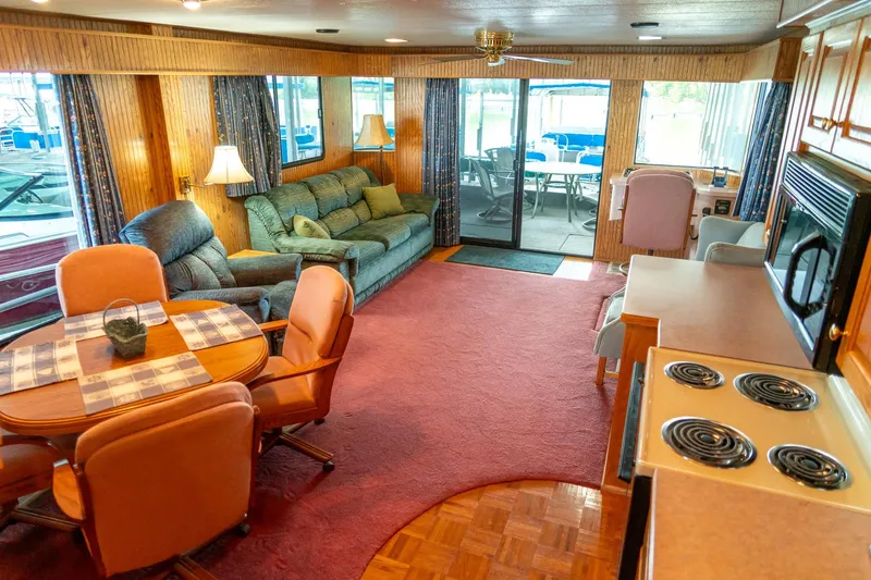 Slide: The Image of Interior of a 1995 Lakeview 62 x 14 Widebody Houseboat with cozy living area and kitchen. - 24
