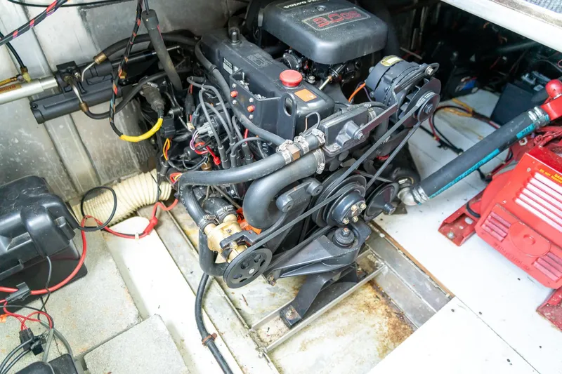 Slide: The Image of Engine compartment of a 1995 Lakeview 62 x 14 Widebody Houseboat, showcasing mechanical components. - 48