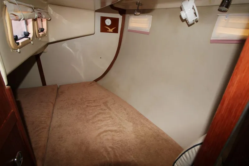 Slide: The Image of Interior cabin of 1989 Hunter Legend 35.5 sailboat with cozy bed and portholes. - 20