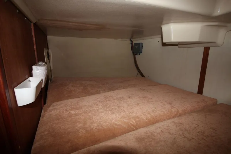 Slide: The Image of Interior cabin of 1989 Hunter Legend 35.5 sailboat with cozy bedding. - 21