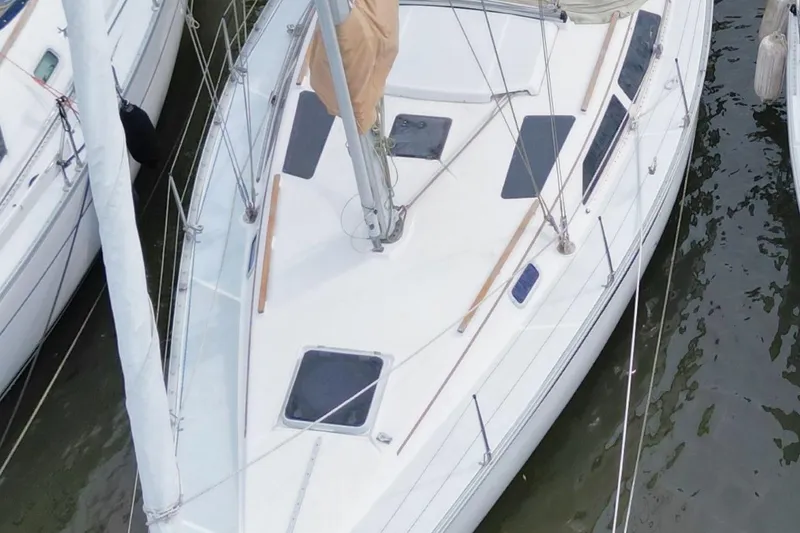 Slide: The Image of 1989 Hunter Legend 35.5 sailboat docked, aerial view of deck and rigging. - 6