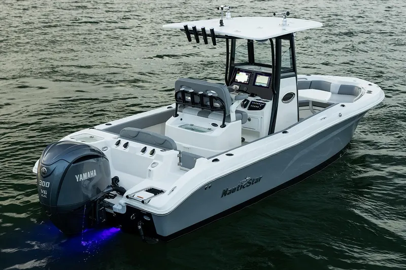 Slide: The Image of 2023 NauticStar 24 XS boat with Yamaha engine on water. - 3