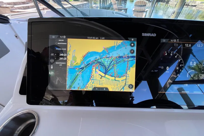 Slide: The Image of Simrad navigation display on 2022 Sea Ray SLX 310 Outboard, showing detailed marine map. - 15