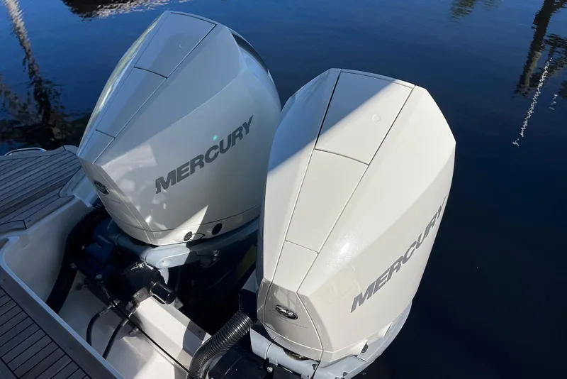 Slide: The Image of Twin Mercury outboard engines on a 2022 Sea Ray SLX 310 boat. - 37