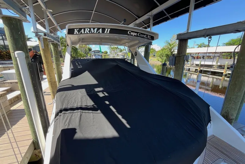 Slide: The Image of 2022 Sea Ray SLX 310 Outboard covered at dock in Cape Coral, Florida. - 38