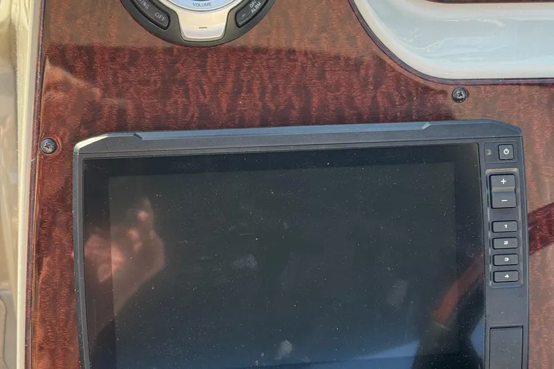 Slide: The Image of Control panel of a 2012 Sea Ray 280 Sundancer boat with touchscreen display. - 12