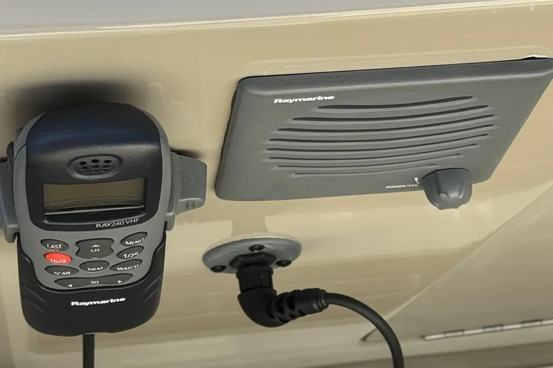 Slide: The Image of Raymarine VHF radio and speaker on 2012 Sea Ray 280 Sundancer boat. - 13