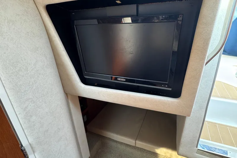 Slide: The Image of Flat-screen TV in 2012 Sea Ray 280 Sundancer cabin interior. - 21