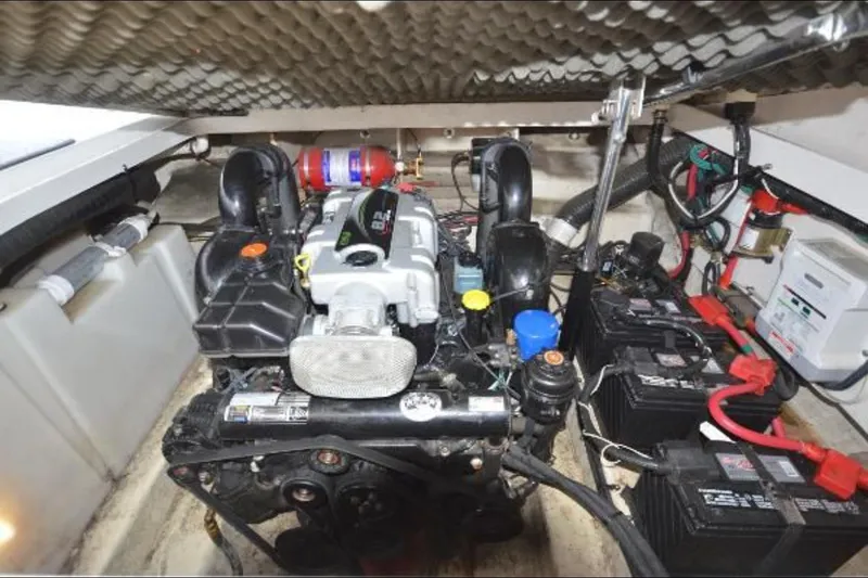Slide: The Image of Engine compartment of 2012 Sea Ray 280 Sundancer with batteries and wiring. - 30