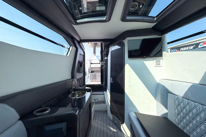 Slide: The Image of Luxurious interior of 2019 Nor-Tech 450 Sport Center Console with modern amenities. - 13